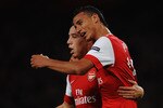 LONDON, ENGLAND - OCTOBER 19:  Samir Nasri of Arsenal celebrates with team mate Marouane Chamakh (R) as he scores their second goal during the UEFA Champions League Group H match between Arsenal and FC Shakhtar Donetsk at the Emirates Stadium on October 19, 2010 in London, England.  (Photo by Laurence Griffiths/Getty Images)