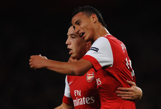 LONDON, ENGLAND - OCTOBER 19:  Samir Nasri of Arsenal celebrates with team mate Marouane Chamakh (R) as he scores their second goal during the UEFA Champions League Group H match between Arsenal and FC Shakhtar Donetsk at the Emirates Stadium on October 19, 2010 in London, England.  (Photo by Laurence Griffiths/Getty Images)