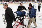 EAST RUTHERFORD, NJ - MARCH 2:  Tomas Kaberle #15 of the Toronto Maple Leafs is carried off the ice on a stretcher after being injured against the New Jersey Devils during their NHL game on March 2, 2007 at the Continental Airlines Arena in East Rutherford, New Jersey. The Maple Leafs beat the Devils 4-3 in a shootout. (Photo by: Mike Stobe/Getty Images)