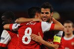 LONDON, ENGLAND - OCTOBER 19:  Samir Nasri of Arsenal (8) celebrates with team mate Cesc Fabregas as he scores their second goal during the UEFA Champions League Group H match between Arsenal and FC Shakhtar Donetsk at the Emirates Stadium on October 19, 2010 in London, England.  (Photo by Laurence Griffiths/Getty Images)