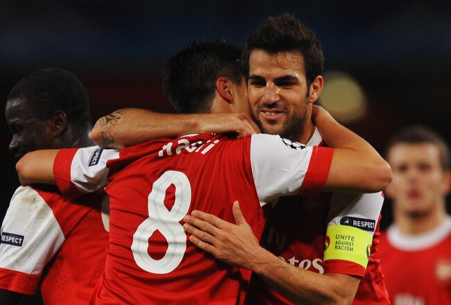 LONDON, ENGLAND - OCTOBER 19:  Samir Nasri of Arsenal (8) celebrates with team mate Cesc Fabregas as he scores their second goal during the UEFA Champions League Group H match between Arsenal and FC Shakhtar Donetsk at the Emirates Stadium on October 19, 2010 in London, England.  (Photo by Laurence Griffiths/Getty Images)
