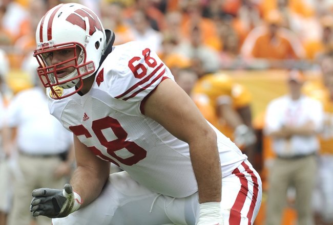 TAMPA, FL -  JANUARY 1: Lineman Gabe Carimi #68 of the Wisconsin Badgers sets to block  against the Tennessee Volunteers in the 2008 Outback Bowl at Raymond James Stadium on January 1, 2008 in Tampa, Florida.  The Volunteers won 21 - 17. (Photo by Al Messerschmidt/Getty Images)