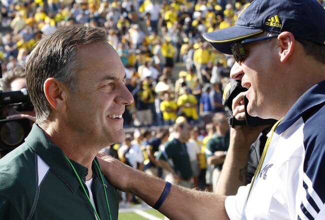 ANN ARBOR, MI - OCTOBER 09: Michigan State head coach Mark Dantonio and Michigan head coach Rich Rodriguez meet prior to the start of the game October 9, 2010 at Michigan Stadium in Ann Arbor, Michigan. (Photo by Leon Halip/Getty Images)