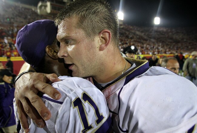 LOS ANGELES, CA - OCTOBER 02:  Quarterback Jake Locker #10 and wide receiver D'Andre Goodwin #11 of the Washington Huskies embrace after the game with the USC Trojans at the Los Angeles Memorial Coliseum on October 2, 2010 in Los Angeles, California.  Washington won 32-31.  (Photo by Stephen Dunn/Getty Images)