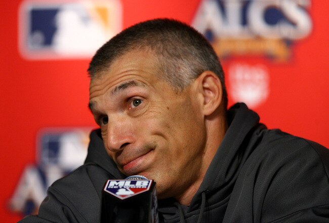 NEW YORK - OCTOBER 18:  Manager Joe Girardi of the New York Yankees speaks during his pregame press conference against the Texas Rangers prior to Game Three of the ALCS during the 2010 MLB Playoffs at Yankee Stadium on October 18, 2010 in New York, New York.  (Photo by Andrew Burton/Getty Images)