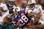 MINNEAPOLIS - SEPTEMBER 19:  Adrian Peterson #28 of the Minnesota Vikings carries the ball as he is tackled by the Miami Dolphins defense during the first half of the game on September 19, 2010 at Hubert H. Humphrey Metrodome in Minneapolis, Minnesota.  (Photo by Jamie Squire/Getty Images)