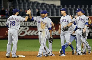NEW YORK - OCTOBER 19:  Mitch Moreland #18, Nelson Cruz #17, David Murphy #7 and Josh Hamilton #32 of the Texas Rangers celebrate after the Rangers won 10-3 against the New York Yankees in Game Four of the ALCS during the 2010 MLB Playoffs at Yankee Stadium on October 19, 2010 in the Bronx borough of New York City.  (Photo by Jim McIsaac/Getty Images)