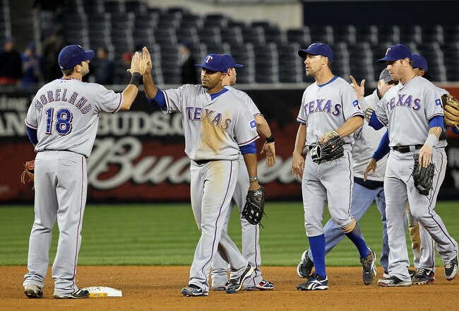 NEW YORK - OCTOBER 19:  Mitch Moreland #18, Nelson Cruz #17, David Murphy #7 and Josh Hamilton #32 of the Texas Rangers celebrate after the Rangers won 10-3 against the New York Yankees in Game Four of the ALCS during the 2010 MLB Playoffs at Yankee Stadium on October 19, 2010 in the Bronx borough of New York City.  (Photo by Jim McIsaac/Getty Images)