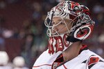 VANCOUVER, CANADA - OCTOBER 17: Goalie Cam Ward #30 of the Carolina Hurricanes takes a break during the pre-game skate prior to NHL action against the Vancouver Canucks on October 17, 2010 at Rogers Arena in Vancouver, British Columbia, Canada.  (Photo by Rich Lam/Getty Images)