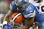 DETROIT - AUGUST 28:  Ndamukong Suh #90 of the Detroit Lions tackles Jake Delhomme #17 of the Cleveland Browns during a preseason game on August 28, 2010 at Ford Field in Detroit, Michigan. Suh was called for a personal foul on the play for grabbing the face mask. (Photo by Gregory Shamus/Getty Images)