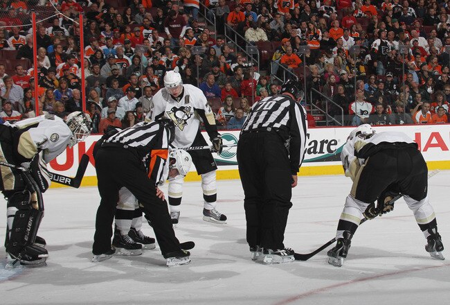 PHILADELPHIA - OCTOBER 16: The Pittsburgh Penguins look for a tooth from teammate Alex Gologoski #3 (not shown) that was knocked out by Jeff Carter #17 of the Philadelphia Flyers at the Wells Fargo Center on October 16, 2010 in Philadelphia, Pennsylvania. The Penguins defeated the Flyers 5-1. (Photo by Bruce Bennett/Getty Images)