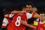 LONDON, ENGLAND - OCTOBER 19:  Samir Nasri of Arsenal (8) celebrates with team mate Cesc Fabregas as he scores their second goal during the UEFA Champions League Group H match between Arsenal and FC Shakhtar Donetsk at the Emirates Stadium on October 19, 2010 in London, England.  (Photo by Laurence Griffiths/Getty Images)