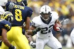 ANN ARBOR, MI - OCTOBER 24: Evan Royster #22 of the Penn State Nittany Lions looks to get around the tackle of Jonas Mouton #8 of the Michigan Wolverines on October 24, 2009 at Michigan Stadium in Ann Arbor, Michigan.  (Photo by Gregory Shamus/Getty Images)
