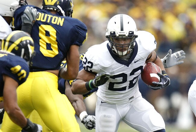 ANN ARBOR, MI - OCTOBER 24: Evan Royster #22 of the Penn State Nittany Lions looks to get around the tackle of Jonas Mouton #8 of the Michigan Wolverines on October 24, 2009 at Michigan Stadium in Ann Arbor, Michigan.  (Photo by Gregory Shamus/Getty Images)