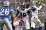 DETROIT - OCTOBER 10:  Steven Jackson #39 of the St. Louis Rams takes a handoff from Sam Bradford and tries to get around the tackle of Louis Delmas #26 of the Detroit Lions on October 10, 2010 at Ford Field in Detroit, Michigan.  (Photo by Gregory Shamus/Getty Images)