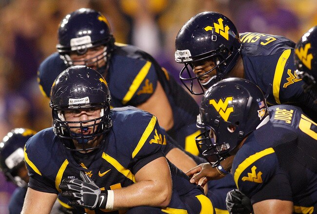 BATON ROUGE, LA - SEPTEMBER 25:  Quarterback Geno Smith #12 of the West Virginia Mountaineers in action against the Louisiana State University Tigers at Tiger Stadium on September 25, 2010 in Baton Rouge, Louisiana.  (Photo by Chris Graythen/Getty Images)