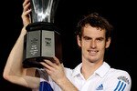 SHANGHAI, CHINA - OCTOBER 17:  Andy Murray of Great Britain poses for photographers after defeating Roger Federer of Switzerland during the final on day seven of the 2010 Shanghai Rolex Masters at the Shanghai Qi Zhong Tennis Center on October 17, 2010 in Shanghai, China.  (Photo by Matthew Stockman/Getty Images)