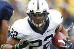 ANN ARBOR, MI - OCTOBER 24: Evan Royster #22 of the Penn State Nittany Lions looks to get around the tackle of Jonas Mouton #8 of the Michigan Wolverines on October 24, 2009 at Michigan Stadium in Ann Arbor, Michigan.  (Photo by Gregory Shamus/Getty Images)