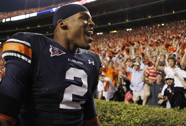 AUBURN, AL - OCTOBER 16:  Quarterback Cam Newton #2 of the Auburn Tigers celebrates with the crowd after the game against the Arkansas Razorbacks at Jordan-Hare Stadium on October 16, 2010 in Auburn, Alabama.  The Tigers beat the Razorbacks 65-43.  (Photo by Mike Zarrilli/Getty Images)