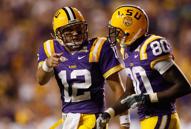 BATON ROUGE, LA - OCTOBER 16:  Jarrett Lee #12 talks with Terrence Toliver #80 of the Louisiana State University Tigers after a touchdown during the game against the McNeese State Cowboys at Tiger Stadium on October 16, 2010 in Baton Rouge, Louisiana.  (Photo by Chris Graythen/Getty Images)