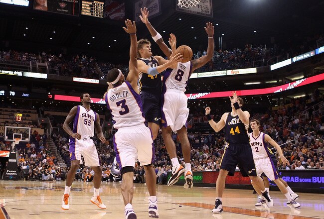 PHOENIX - OCTOBER 12:  Andrei Kirilenko #47 of the Utah Jazz drives to the basket against Jared Dudley #3 of the Phoenix Suns during the preseason NBA game at US Airways Center on October 12, 2010 in Phoenix, Arizona. NOTE TO USER: User expressly acknowledges and agrees that, by downloading and or using this photograph, User is consenting to the terms and conditions of the Getty Images License Agreement.  (Photo by Christian Petersen/Getty Images)