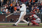 SAN FRANCISCO - OCTOBER 20:  Buster Posey #28 of the San Francisco Giants hits an RBI double against the Philadelphia Phillies in the third inning of Game Four of the NLCS during the 2010 MLB Playoffs at AT&T Park on October 20, 2010 in San Francisco, California.  (Photo by Justin Sullivan/Getty Images)