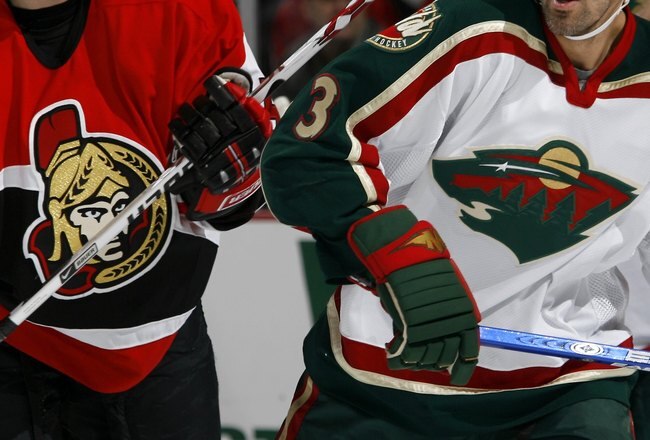 OTTAWA, CANADA - NOVEMBER 20: Keith Carney #3 of the Minnesota Wild skates against Christoph Schubert of the Ottawa Senators on November 20, 2006 at the Scotiabank Place in Ottawa, Canada. The Senators won 5-3. (Photo by Phillip MacCallum/Getty Images)