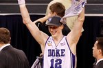 INDIANAPOLIS - APRIL 05:  Kyle Singler #12 of the Duke Blue Devils celebrates after Duke won 61-59 against the Butler Bulldogs during the 2010 NCAA Division I Men's Basketball National Championship game at Lucas Oil Stadium on April 5, 2010 in Indianapolis, Indiana.  (Photo by Kevin C. Cox/Getty Images)