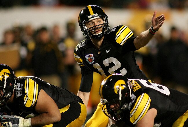 MIAMI GARDENS, FL - JANUARY 05:  Quarterback Ricky Stanzi #12 of the Iowa Hawkeyes gestures at the line of scrimmage against the Georgia Tech Yellow Jackets during the FedEx Orange Bowl at Land Shark Stadium on January 5, 2010 in Miami Gardens, Florida.  (Photo by Marc Serota/Getty Images)