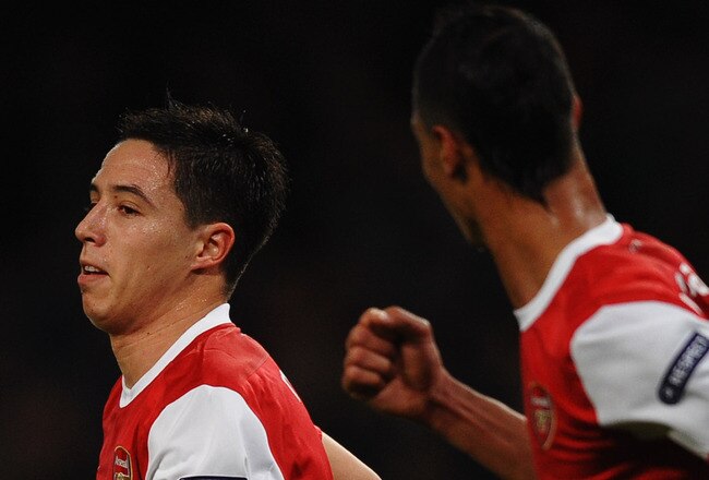 LONDON, ENGLAND - OCTOBER 19:  Samir Nasri of Arsenal (C) celebrates with team mate Marouane Chamakh (R) as he scores their second goal during the UEFA Champions League Group H match between Arsenal and FC Shakhtar Donetsk at the Emirates Stadium on October 19, 2010 in London, England.  (Photo by Laurence Griffiths/Getty Images)