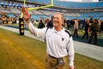 CHARLOTTE, NC - DECEMBER 27:  Head coach Bill Stewart of the West Virginia Mountaineers celebrates after a 31-30 victory over the North Carolina Tar Heels after the Meineke Car Care Bowl on December 27, 2008 at Bank of America Stadium in Charlotte, North Carolina.  (Photo by Streeter Lecka/Getty Images)