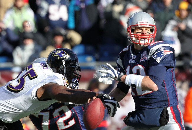 FOXBORO, MA - JANUARY 10:  Terrell Suggs #55 of the Baltimore Ravens stripes the ball from Tom Brady #12 of the New England Patriots during the first quarter of  the 2010 AFC wild-card playoff game at Gillette Stadium on January 10, 2010 in Foxboro, Massachusetts.  (Photo by Jim Rogash/Getty Images)