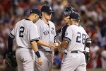 ARLINGTON, TX - OCTOBER 22:  Manager Joe Girardi of the New York Yankees pulls Phil Hughes #65 in Game Six of the ALCS against the Texas Rangers during the 2010 MLB Playoffs at Rangers Ballpark in Arlington on October 22, 2010 in Arlington, Texas.  (Photo by Stephen Dunn/Getty Images)