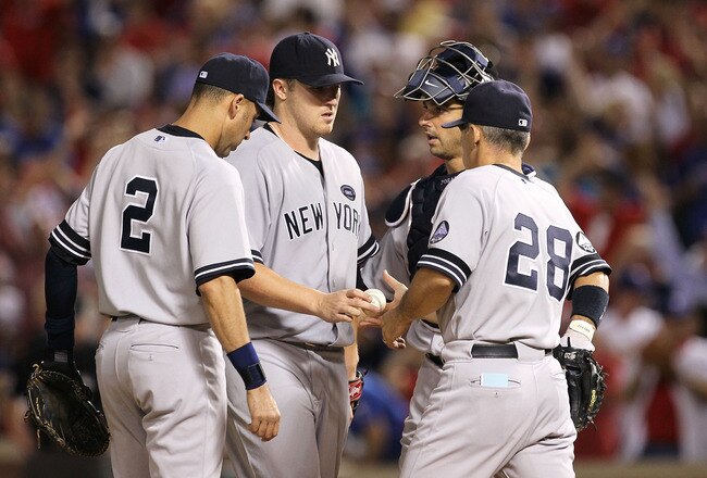 ARLINGTON, TX - OCTOBER 22:  Manager Joe Girardi of the New York Yankees pulls Phil Hughes #65 in Game Six of the ALCS against the Texas Rangers during the 2010 MLB Playoffs at Rangers Ballpark in Arlington on October 22, 2010 in Arlington, Texas.  (Photo by Stephen Dunn/Getty Images)