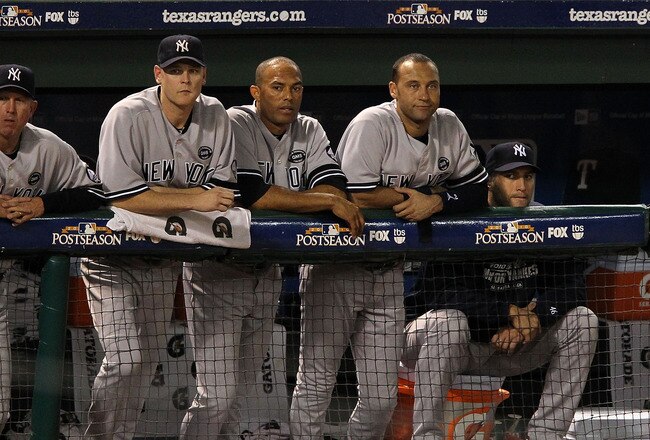 ARLINGTON, TX - OCTOBER 22:  (2nd from L-R) Kerry Wood #39, Mariano Rivera #42, Derek Jeter #2, and Andy Pettitte #46 of the New York Yankees look on from the dugout during Game Six of the ALCS against the Texas Rangers during the 2010 MLB Playoffs at Rangers Ballpark in Arlington on October 22, 2010 in Arlington, Texas.  (Photo by Ronald Martinez/Getty Images)