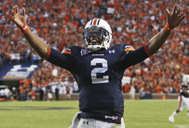 AUBURN - OCTOBER 16:  Quarterback Cam Newton #2 of the Auburn Tigers celebrates during the game against the Arkansas Razorbacks at Jordan-Hare Stadium on October 16, 2010 in Auburn, Alabama.  The Tigers beat the Razorbacks 65-43.  (Photo by Mike Zarrilli/Getty Images)