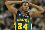HOUSTON - MARCH 28: Guard LaceDarius Dunn #24 of the Baylor Bears reacts during a 78-71 loss against the Duke Blue Devils during the south regional final of the 2010 NCAA men's basketball tournament at Reliant Stadium on March 28, 2010 in Houston, Texas. (Photo by Ronald Martinez/Getty Images)