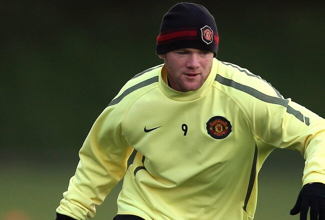 MANCHESTER, ENGLAND - OCTOBER 19:  Wayne Rooney of Manchester United runs with the ball during a training session at the Carrington Training Complex on October 19, 2010 in Manchester, England.  (Photo by Alex Livesey/Getty Images)