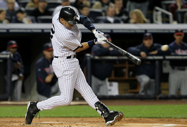 NEW YORK - OCTOBER 09:  Derek Jeter #2 of the New York Yankees singles in the bottom of the first inning against the Minnesota Twins during Game Three of the ALDS part of the 2010 MLB Playoffs at Yankee Stadium on October 9, 2010 in the Bronx borough of New York City.  (Photo by Jim McIsaac/Getty Images)