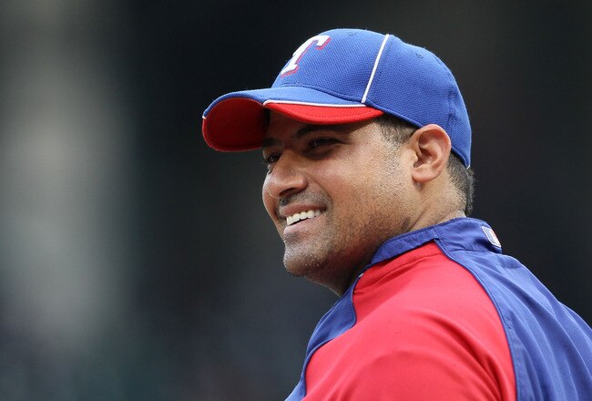 ARLINGTON, TX - OCTOBER 22:  Bengie Molina #11 of the Texas Rangers looks on during batting practice prior to playing the New York Yankees in Game Six of the ALCS during the 2010 MLB Playoffs at Rangers Ballpark in Arlington on October 22, 2010 in Arlington, Texas.  (Photo by Elsa/Getty Images)