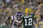 GREEN BAY, WI - OCTOBER 24:  Jared Allen #69 of the Minnesota Vikings pressures Aaron Rodgers #12 of the Green Bay Packers at Lambeau Field on October 24, 2010 in Green Bay, Wisconsin. (Photo by Jim Prisching/Getty Images)