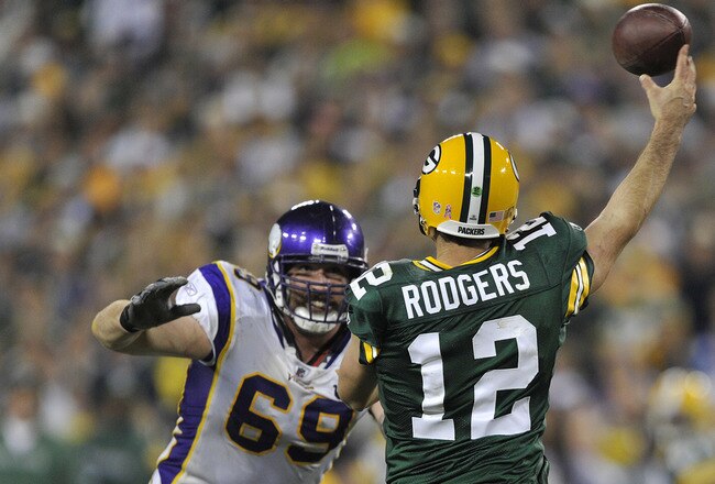 GREEN BAY, WI - OCTOBER 24:  Jared Allen #69 of the Minnesota Vikings pressures Aaron Rodgers #12 of the Green Bay Packers at Lambeau Field on October 24, 2010 in Green Bay, Wisconsin. (Photo by Jim Prisching/Getty Images)