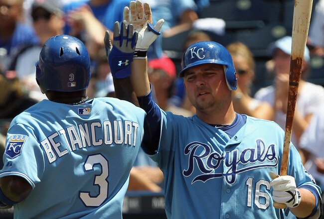 KANSAS CITY, MO - JULY 28:  Billy Butler #16 of the Kansas City Royals congratulates Yuniesky Betancourt #3 after a run during the game against  the Minnesota Twins on July 28, 2010 at Kauffman Stadium in Kansas City, Missouri.  (Photo by Jamie Squire/Getty Images)