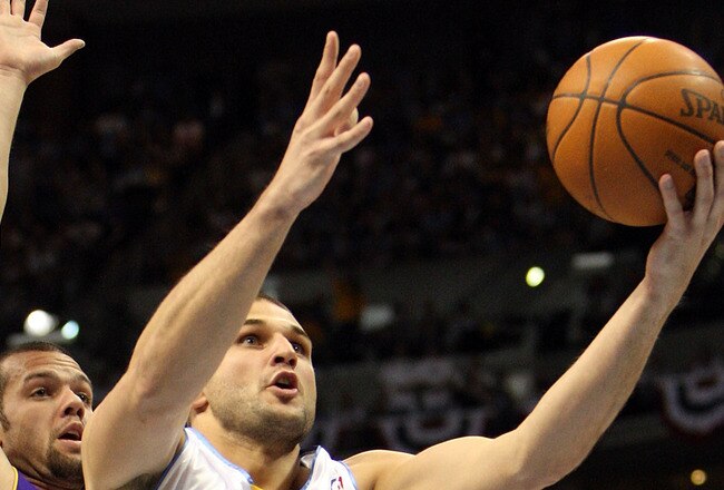 DENVER - MAY 29:  Linas Kleiza #43 of the Denver Nuggets goes up for a shot in front of Jordan Farmar #5 of the Los Angeles Lakers in Game Six of the Western Conference Finals during the 2009 NBA Playoffs at Pepsi Center on May 29, 2009 in Denver, Colorado. NOTE TO USER: User expressly acknowledges and agrees that, by downloading and or using this photograph, User is consenting to the terms and conditions of the Getty Images License Agreement.  (Photo by Jed Jacobsohn/Getty Images)