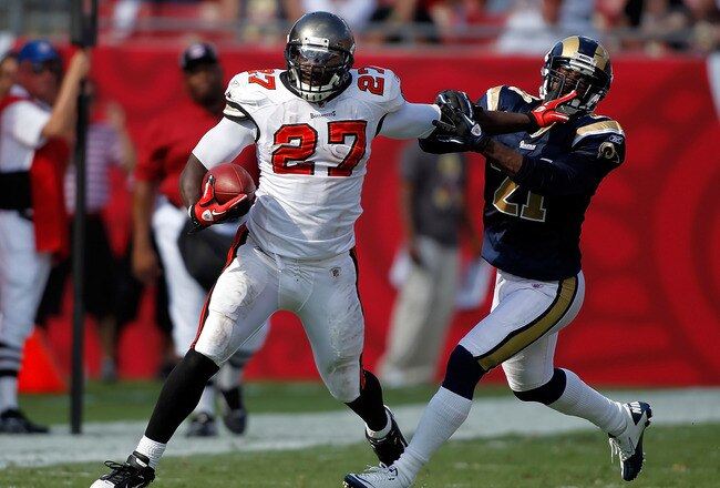 TAMPA, FL - OCTOBER 24:  Running back LeGarrette Blount #27 of the Tampa Bay Buccaneers straight arms safety Oshiomogho Atogwe #21 of the St. Louis Rams during the game at Raymond James Stadium on October 24, 2010 in Tampa, Florida.  (Photo by J. Meric/Getty Images)