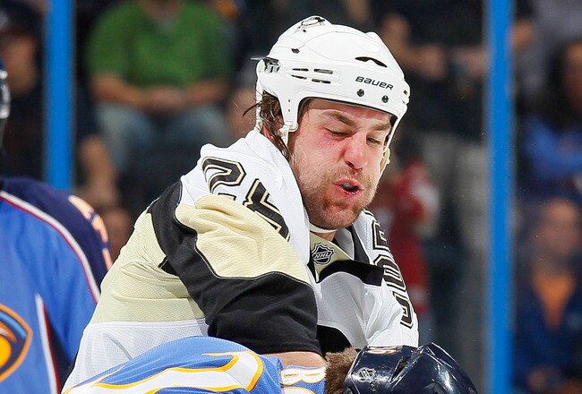 ATLANTA - APRIL 10:  Eric Godard #28 of the Pittsburgh Penguins fights with Eric Boulton #36 of the Atlanta Thrashers at Philips Arena on April 10, 2010 in Atlanta, Georgia.  (Photo by Kevin C. Cox/Getty Images)