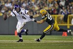 GREEN BAY, WI - OCTOBER 24:  Brett Favre #4 of the Minnesota Vikings has his jersey grabbed by Clay Matthews #52 of the Green Bay Packers at Lambeau Field on October 24, 2010 in Green Bay, Wisconsin. (Photo by Jim Prisching/Getty Images)