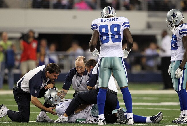 ARLINGTON, TX - OCTOBER 25:  Quarterback Tony Romo #9 of the Dallas Cowboys lies on the field after a left shoulder injury in the second quarter against the New York Giants at Cowboys Stadium on October 25, 2010 in Arlington, Texas.  (Photo by Ronald Martinez/Getty Images)