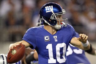 ARLINGTON, TX - OCTOBER 25:  Quarterback Eli Manning #10 of the New York Giants looks to pass against the Dallas Cowboys at Cowboys Stadium on October 25, 2010 in Arlington, Texas.  (Photo by Ronald Martinez/Getty Images)