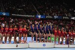 ROTTERDAM, NETHERLANDS - OCTOBER 20:  Russia's Gold medallists (C), US Silver medallists (L) and China's Bronze medallists (R) celebrate on the podium at the end of the Women's team final at the 42nd Artistic Gymnastics World Championships at Ahoy on October 20, 2010 in Rotterdam, Netherlands.  (Photo by Jamie McDonald/Getty Images)